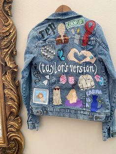 Taylor Swift Taylor Swift Eras Tour Jacket, Taylors Version Necklace, Painted Jean Jacket Taylor Swift, Denim Jacket Applique Diy, Taylor Swift Eras Tour Denim Jacket, Taylor Swift Eras Jacket, Painted Denim Jacket Taylor Swift, Taylor Swift Jacket Ideas