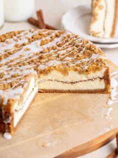 a cake that has been cut in half on a cutting board with one slice taken out