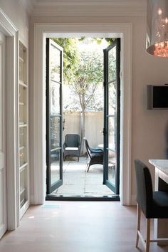 an open door leading to a patio area