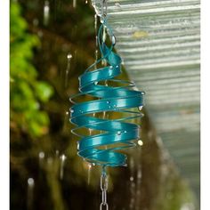 a blue wind chime hanging from a ceiling