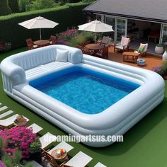 an inflatable swimming pool with lounge chairs and umbrellas around it on the lawn