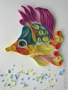 a colorful fish made out of colored paper