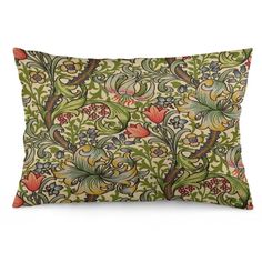 a green and orange pillow with an ornate design on the front, featuring flowers and leaves