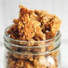 a jar filled with granola sitting on top of a table