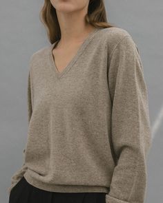 Fine merino wool v neck in a relaxed, feminine silhouette. - Relaxed fit- V neck- Dropped shoulders- Ribbed neckline, hem, cuffs- Length 22.5", Bust 41", Sleeve 31"- Merino Wool 55%, Nylon 45%- Dry clean- Imported Ash Beige, Feminine Silhouette, Outerwear Outfit, Ribbed Neckline, V Neck Sweater, Wide Leg Trousers, Vneck Sweater, Neck Sweater, Clothing And Shoes