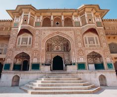 an ornate building with steps leading up to it