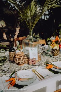 the table is set with plates and place settings