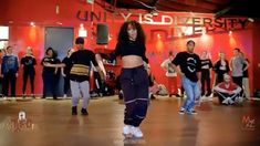 a group of young people dancing in a dance studio