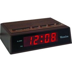 an alarm clock with red numbers on it