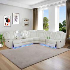 a living room with a large white sectional couch in the center and blue lights on the side