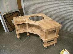 two wooden tables sitting next to each other in front of a garage door