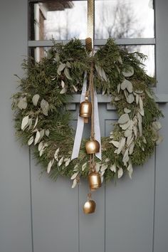 a wreath with bells hanging from it