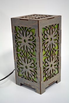 a small wooden box with an intricate design