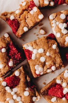 several dessert squares with white chocolate chips and cherries