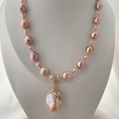 Explore the gentle hues of our Pink to Purple Large Baroque Pearl Necklace. This exquisite piece features stunning freshwater pearls, showcasing a mesmerizing transition from soft pink to elegant purple. Each large Baroque pearl is unique, making your necklace a one-of-a-kind treasure. Perfect for adding a touch of soft color and sophistication to any outfit. Handmade Drop Pearl Necklace, High Luster Pearl Pendant Necklace, Elegant Pink Pear-shaped Necklace, Pink Pearl Drop Pendant Necklace, Single Strand Pearl Pendant Necklace For Jewelry Making, Pink Baroque Pearl Necklaces For Wedding, Elegant Pink Pearl Pendant Necklace, Elegant Pink Pendant Pearl Necklace, Pink Baroque Pearl Necklace For Wedding