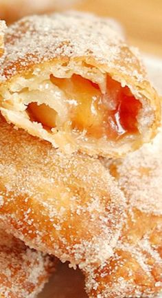 some sugar covered pastries on a white plate