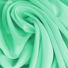 a close up view of a green fabric