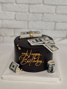 a birthday cake with money on top