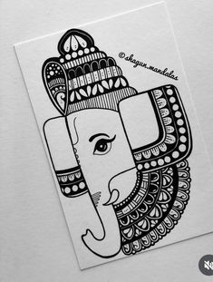 an elephant is drawn in black and white with intricate designs on it's face