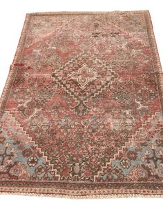 an antique persian rug with red and blue colors