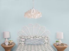 a bedroom with blue walls and wicker furniture