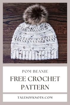 a white crochet hat with a pom - beanie on top