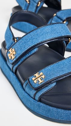 Upper: DenimGold-tone hardware and logo emblem at sidesMolded footbedVelcro closureOpen toeRubber soleImported, VietnamThis item cannot be gift-boxedPlatform profileStyle #TORYB50666 Tory Burch Kira, Classic American Style, Tory Burch Sandals, Logo Emblem, Sport Sandals, Classic American, Tory Burch Shoes, Denim Blue, Ankle Strap