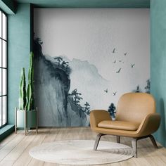 an empty chair in front of a wall with birds flying over the mountains and trees