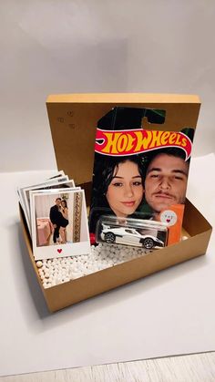 a cardboard box filled with photos and pictures