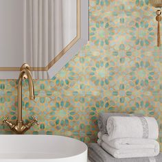 a white sink sitting under a bathroom mirror next to a wall mounted faucet