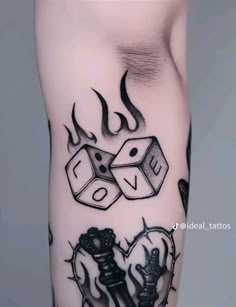 a black and white tattoo with two dices on it