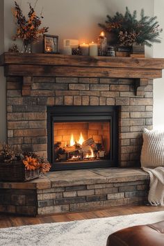 a living room with a fire place in the center and candles on top of it