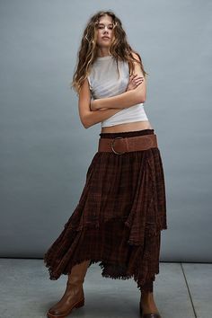 Perfect in plaid, this quintessentially FP maxi skirt will be your go-to all season long. **Fit:** Mid-rise, billowy tiered fit **Features:** Elastic waistband for pull-on ease, plaid print throughout, asymmetrical tiered hemline, raw-edge seaming throughout **Why We ❤ It:** Toughened-up with moto boots or sleek with kitten heels, this style has endless ways to wear. | FP One Averie Maxi Skirt at Free People in Brown, Size: S Boho Skirt Outfit, Mid Skirt Outfits, Magic Skirt, Long Plaid Skirt, Brown Maxi Skirts, Flannel Skirt, Mid Skirt, Maxi Skirt Outfits, Maxi Skirt Boho