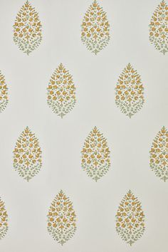 a white wall with yellow and green designs on it