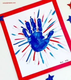 a hand print on a card with stars around it