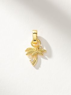 Bring a tropical feel to your look with our Palm Tree Charm. This gold charm features two shining stones and is the perfect addition to your charm necklace or charm bracelet. Want more palm tree styles? Be sure to check out the full collection. | Palm Tree Charm Jewelry in Gold | Uncommon James Uncommon James, Gift Exchange, Jewelry Cleaner, Gold Charm, Cleaning Jewelry, Palm Tree, Charm Jewelry, Palm Trees, Charm Necklace