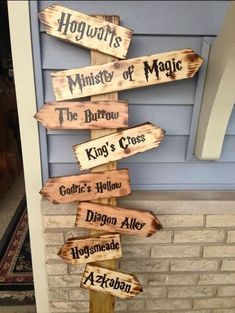 a wooden sign that says hogwarts, the mystery of magic and the king's cross