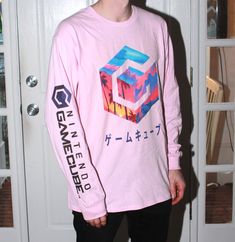 VaporWave style long-sleeve T-shirt available in 3 colors: White, Light Pink, Light Blue.  The right sleeve has the GameCube text logo printed on it.  Cotton shirt with water based ink.  Printed in house on our DTG equipment.  Please message me with any questions. Spring Long Sleeve Graphic T-shirt, Casual Long Sleeve Graphic T-shirt, Pink Long Sleeve T-shirt With Text Print, Spring Streetwear Long Sleeve Shirt, Cotton Long Sleeve Sweatshirt With Graphic Print, Cotton Long Sleeve Streetwear Tops, Long Sleeve Cotton Tops For Streetwear, Cotton Long Sleeve Tops For Streetwear, Spring Crew Neck T-shirt With Screen Print