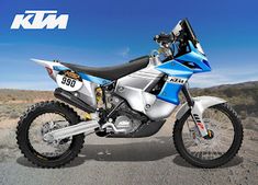 a blue and white dirt bike parked in the desert