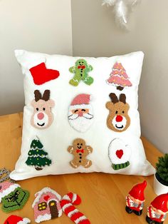 a white pillow with christmas decorations on it