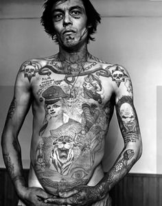 a man with many tattoos on his body