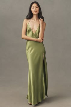 The Bardot Yve Halter Open-Back Front-Slit Silky Maxi Dress exudes timeless elegance with its sleek silhouette, alluring open-back design, and a daring front slit. | Yve Halter Open-Back Front-Slit Silky Maxi Dress by Bardot in Beige, Women's, Size: 12, Viscose/Silk at Anthropologie Silky Maxi Dress, Beach Wedding Guest Dress, Green Gown, Guest Attire, Halter Maxi Dress, Exclusive Dress, Halter Maxi, Beige Dresses, Halter Maxi Dresses