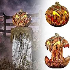 two carved pumpkins sitting on top of a wooden fence next to an image of a truck