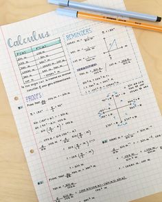 a calculator and pencil sitting on top of a piece of paper with writing