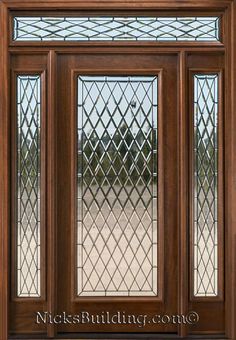 a wooden door with stained glass panels and sidelights on the top part of it