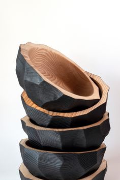 three wooden bowls stacked on top of each other