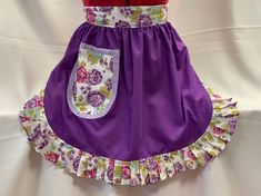 a purple dress with flowers on it