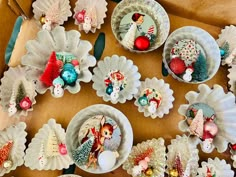 several plates and bowls with christmas decorations on them