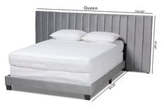 a bed with two pillows on top of it and measurements for the headboard to be made