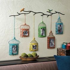 the home and garden essentials $ 500 00 is displayed on a wall with birdcages hanging from it